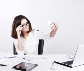 Office female staff using smartphone selfie Stock Photo 01