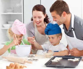 Parents and children cooking in the kitchen Stock Photo 01
