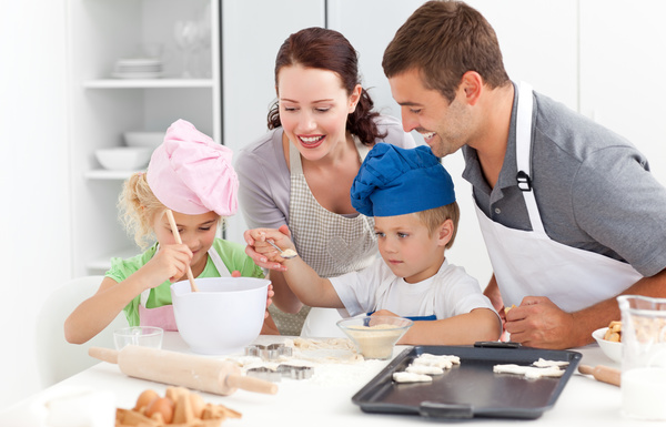 Parents and children cooking in the kitchen Stock Photo 01