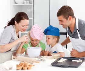 Parents and children cooking in the kitchen Stock Photo 02