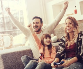Parents play video games with their children Stock Photo 03