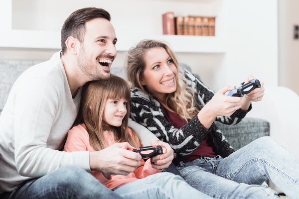 Parents play video games with their children Stock Photo 04
