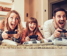 Parents play video games with their children Stock Photo 05