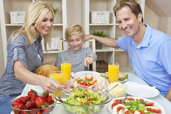 Parents who take care of their children to eat Stock Photo