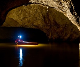 People exploring the cave Stock Photo 01