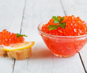 Red caviar on bread with lemon and parsley Stock Photo 02