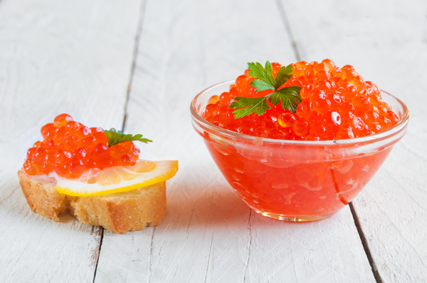 Red caviar on bread with lemon and parsley Stock Photo 02