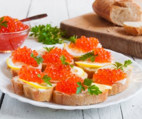 Red caviar on bread with lemon and parsley Stock Photo 05
