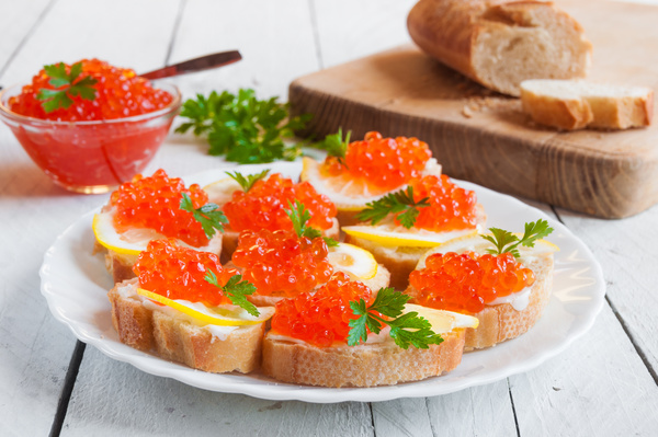 Red caviar on bread with lemon and parsley Stock Photo 05