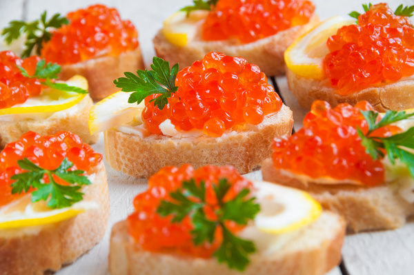 Red caviar on bread with lemon and parsley Stock Photo 11
