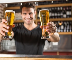 Serving waiter with beer Stock Photo