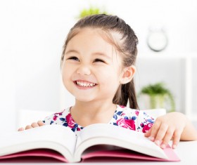 Smiling little girl and book Stock Photo