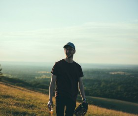Smiling man standing on the grass Stock Photo