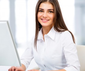Smiling woman using computer Stock Photo 01