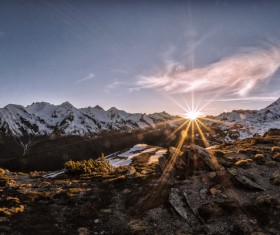 Sunlight on snow mountain scene Stock Photo