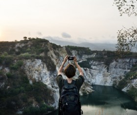 Tourist taking photo of girl Stock Photo