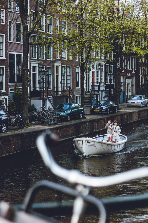 Tourists enjoy boating on river in city Stock Photo