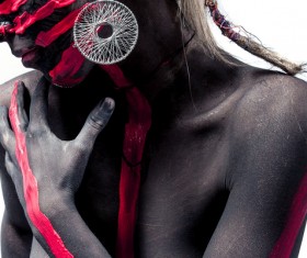 Tribal black person decorated with paint Stock Photo