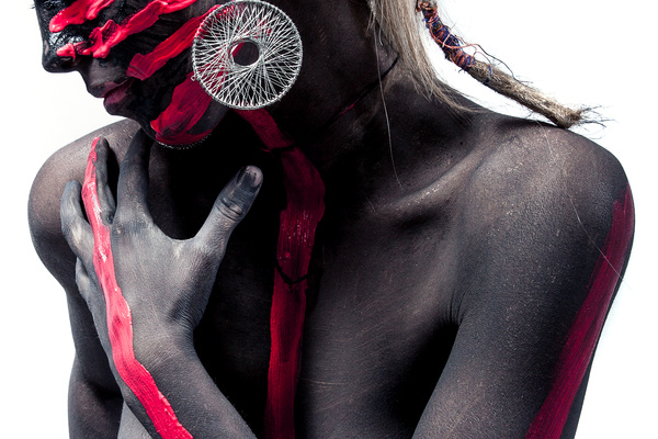 Tribal black person decorated with paint Stock Photo
