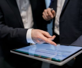 Using Tablet PC for Business Data Analysis Stock Photo 01