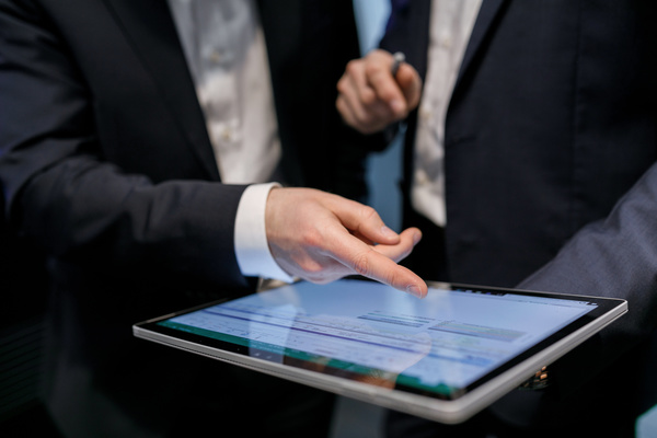 Using Tablet PC for Business Data Analysis Stock Photo 01