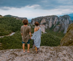 Watching beautiful mountain landscape Couple Stock Photo