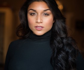 Wearing black pullover garment woman Stock Photo