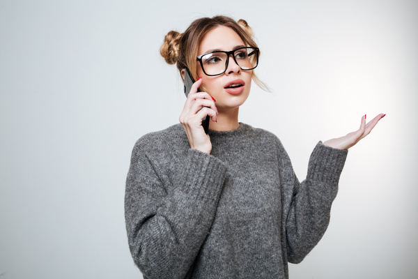 Wearing broad-brimmed glasses girl answered the phone Stock Photo