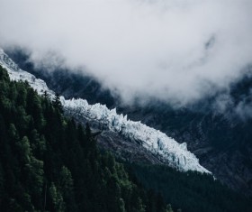 White fog on snowy mountain scene Stock Photo