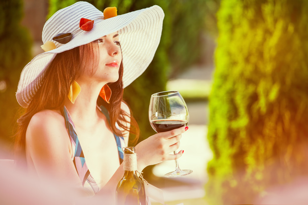 Woman drinking red wine Stock Photo