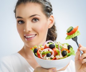 Woman eating salad mixed vegetables Stock Photo 01