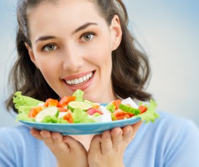 Woman eating salad mixed vegetables Stock Photo 03