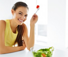 Woman eating salad mixed vegetables Stock Photo 04