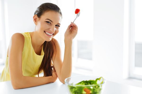 Woman eating salad mixed vegetables Stock Photo 04
