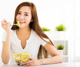 Woman eating salad mixed vegetables Stock Photo 05