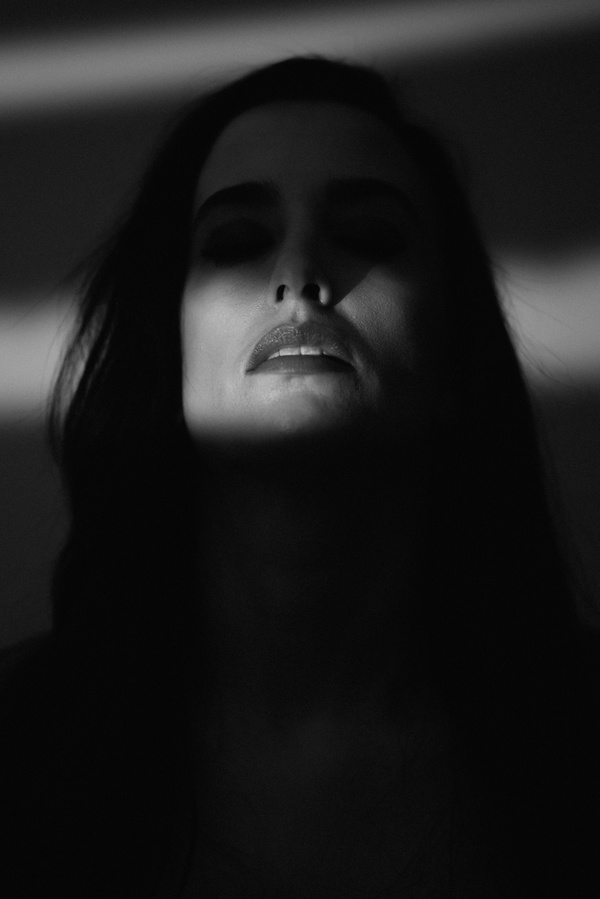 Woman face in darkness Stock Photo
