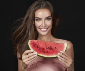 Woman holding a slice of watermelon Stock Photo
