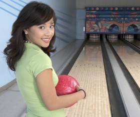Woman playing bowling Stock Photo 01