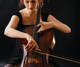 Woman playing cello Stock Photo