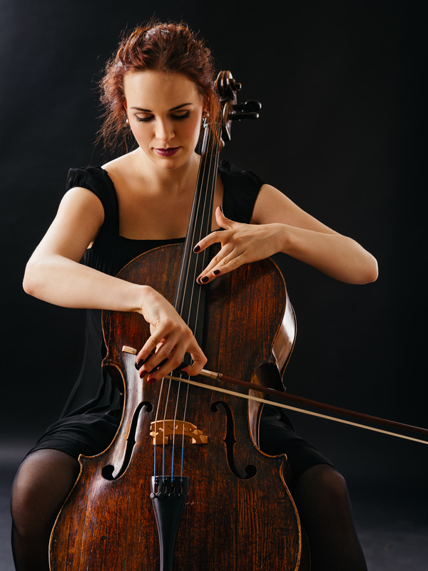Woman playing cello Stock Photo