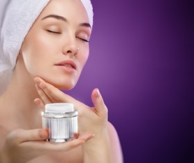Woman rubs moisturizers and creams Stock Photo 01
