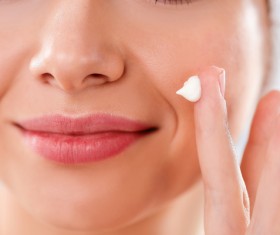 Woman rubs moisturizers and creams Stock Photo 02