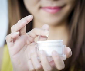 Woman rubs moisturizers and creams Stock Photo 03