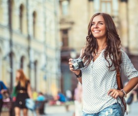 Woman tourist holding camera Stock Photo