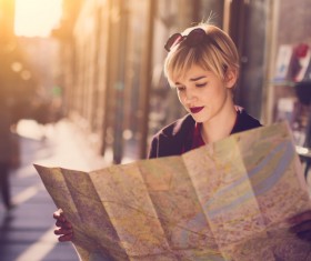 Woman tourist looking at city map Stock Photo 01