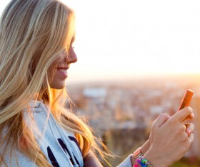 Woman tourist taking picture using smart phone Stock Photo