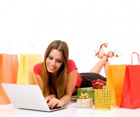Woman using laptop for online shopping Stock Photo