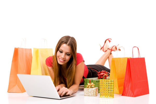 Woman using laptop for online shopping Stock Photo