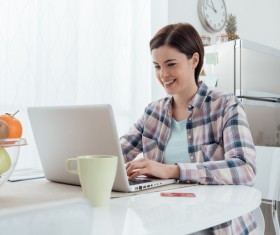 Woman using laptop online at home Stock Photo 02
