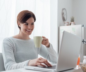 Woman using laptop online at home Stock Photo 05